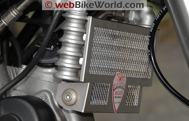 Radiator guard installed; the 5 mm HHCS and titanium-colored washer can be seen on the left.
