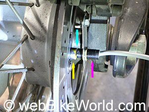 Rear wheel speed sensor mounted on the rear disk brake caliper