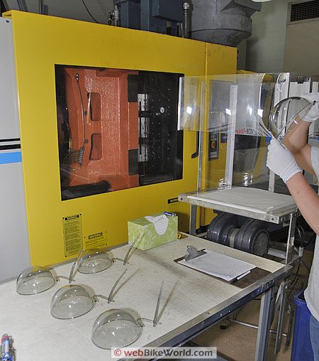 Close-up of visors after they have been removed from the injection molding machine