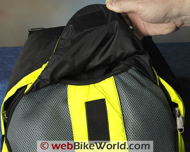 Road Sack Backpack - Outer pocket cover attaches to the body of the backpack with Velcro; elastic is used in the seams.