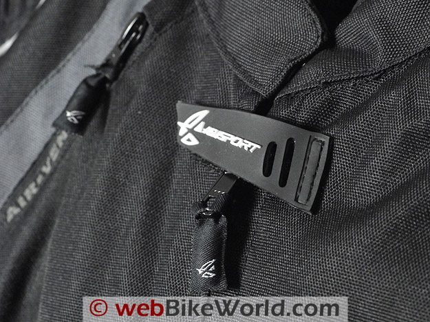 Close-up of zipper pulls and neck closure on the AGV Sport Tempest Jacket.