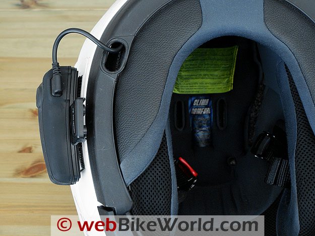 Bottom view of Interphone F4 mounted on motorcycle helmet.