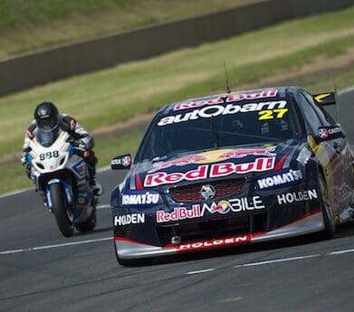 Craig Lowndes races Casey Stoner brake