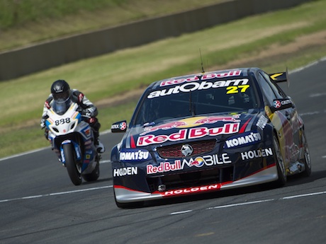 Craig Lowndes races Casey Stoner brake