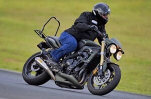 Peter on his Triumph motorcycle Street Triple