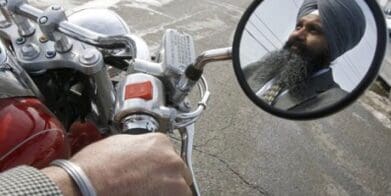 Sikh Baljinder Badesha rides without a helmet turban
