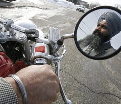 Sikh Baljinder Badesha rides without a helmet turban