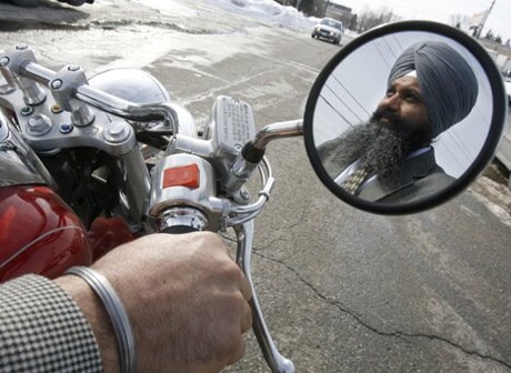 Sikh Baljinder Badesha rides without a helmet turban