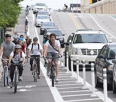 Cyclists in bike lanes ride to work day lane filtering bus lanes reward