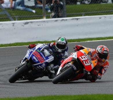 Jorge Lorenzo and Marc Marquez in action motorcycle insurance