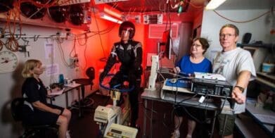 Testing motorcycle in the thermal chamber (from left) research assistant Liz Taylor, volunteer rider Dr Greg Peoples, Liz de Rome and Nigel Taylor. rating award