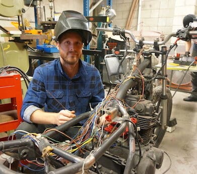 Aaron Green works on a 1982 Kawasaki KZ440 custom street tracker community motorcycle garage