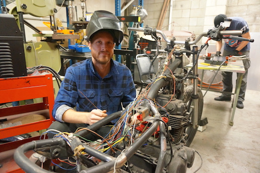 Aaron Green works on a 1982 Kawasaki KZ440 custom street tracker community motorcycle garage