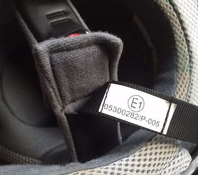 E1 helmet compliance label
