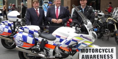 NSW MCC vice-chairman Chris Burns (left), NSW Transport Minister Duncan Gay and police officer - helmet legal issue