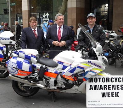 NSW MCC vice-chairman Chris Burns (left), NSW Transport Minister Duncan Gay and police officer - helmet legal issue