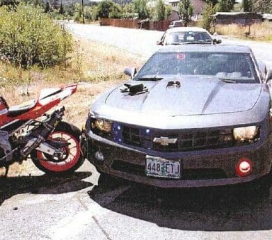 Police Camaro rams motorcycle