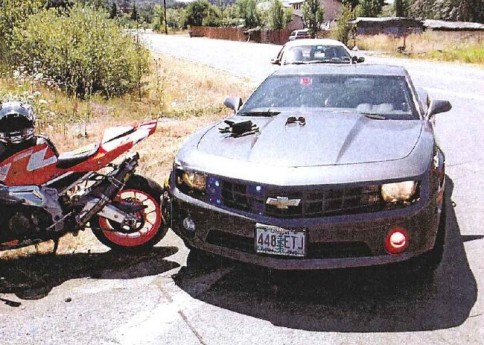 Police Camaro rams motorcycle