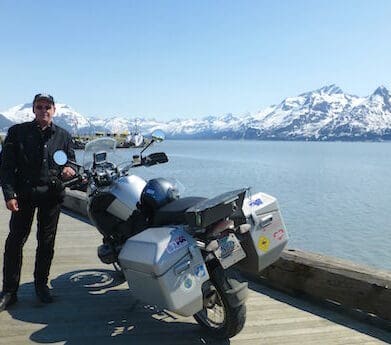 Peter Colwell on the Alaska Highway in 2001, a ride which included his friend John. myth travel insurance