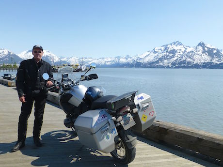 Peter Colwell on the Alaska Highway in 2001, a ride which included his friend John. myth travel insurance