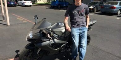 Army vet Brandon Jenkins with his damaged Suzuki
