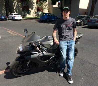 Army vet Brandon Jenkins with his damaged Suzuki