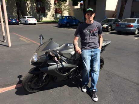 Army vet Brandon Jenkins with his damaged Suzuki