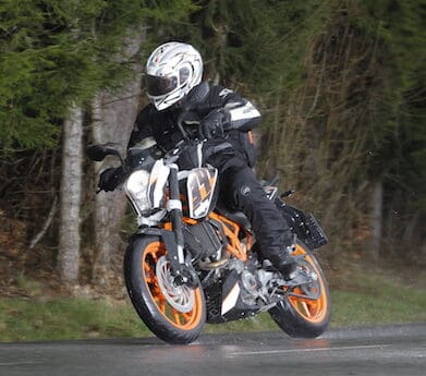 KTM 390 Duke riding in the wet rain students