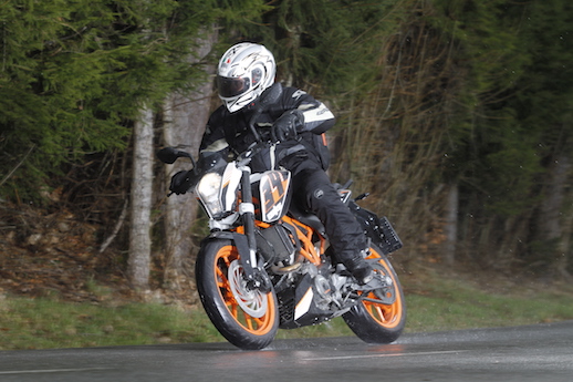 KTM 390 Duke riding in the wet rain students