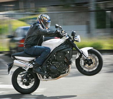 MBW does a wheelie in a private carpark Triumph Street Triple mojo