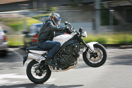 MBW does a wheelie in a private carpark Triumph Street Triple mojo