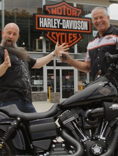 Garry "Gaz" Luxmoore hands over the keys to a Low Rider S to surprised winner Brett Humphries