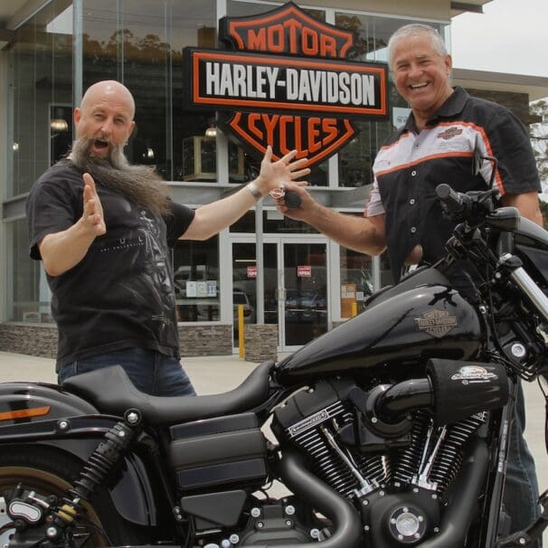 Garry "Gaz" Luxmoore hands over the keys to a Low Rider S to surprised winner Brett Humphries