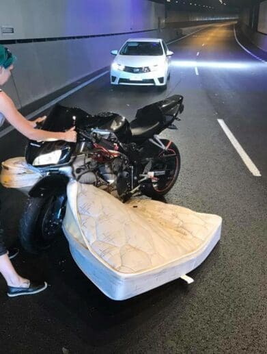 Rider hits unsecured mattress in tunnel