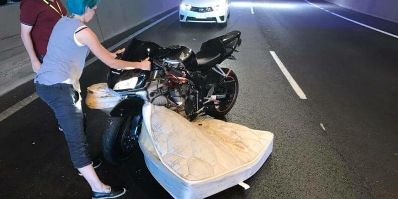Rider hits unsecured mattress in tunnel