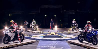 Strong and sexy world of motorbikes world;s strongest man restrains four motorcycles