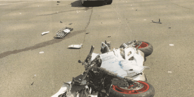 Karen Caruso hit an ambulance that ran a red light