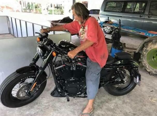 Scruffy customer buys Harley with cash