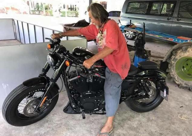 Scruffy customer buys Harley with cash