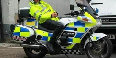 Cop asleep on motorcycle extended