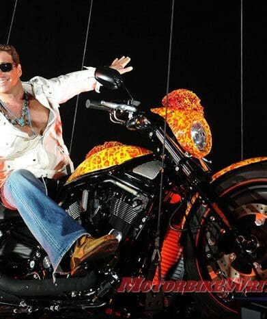 Artist Jack Armstrong unveils his "Cosmic Starship" Harley Davidson on October 21, 2010 in Marina Del Rey, California. Priced at USD one million, this is the world's first and only million dollar Harley. Armstrong was a protege of Andy Warhol and his paintings retail for 300K to 2M USD. AFP PHOTO / GABRIEL BOUYS most expensive blue edition bling