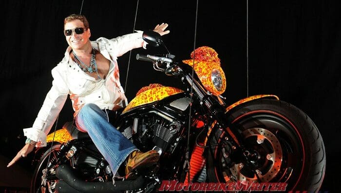 Artist Jack Armstrong unveils his "Cosmic Starship" Harley Davidson on October 21, 2010 in Marina Del Rey, California. Priced at USD one million, this is the world's first and only million dollar Harley. Armstrong was a protege of Andy Warhol and his paintings retail for 300K to 2M USD. AFP PHOTO / GABRIEL BOUYS most expensive blue edition bling