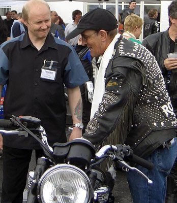 Vintage Triumph rider meets modern Triumph employee