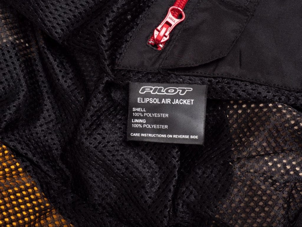 Pilot Motosport Elipsol Air Jacket Closeup of Inner Jacket Product Wash Tag - Shell and Lining are 100% POLYESTER