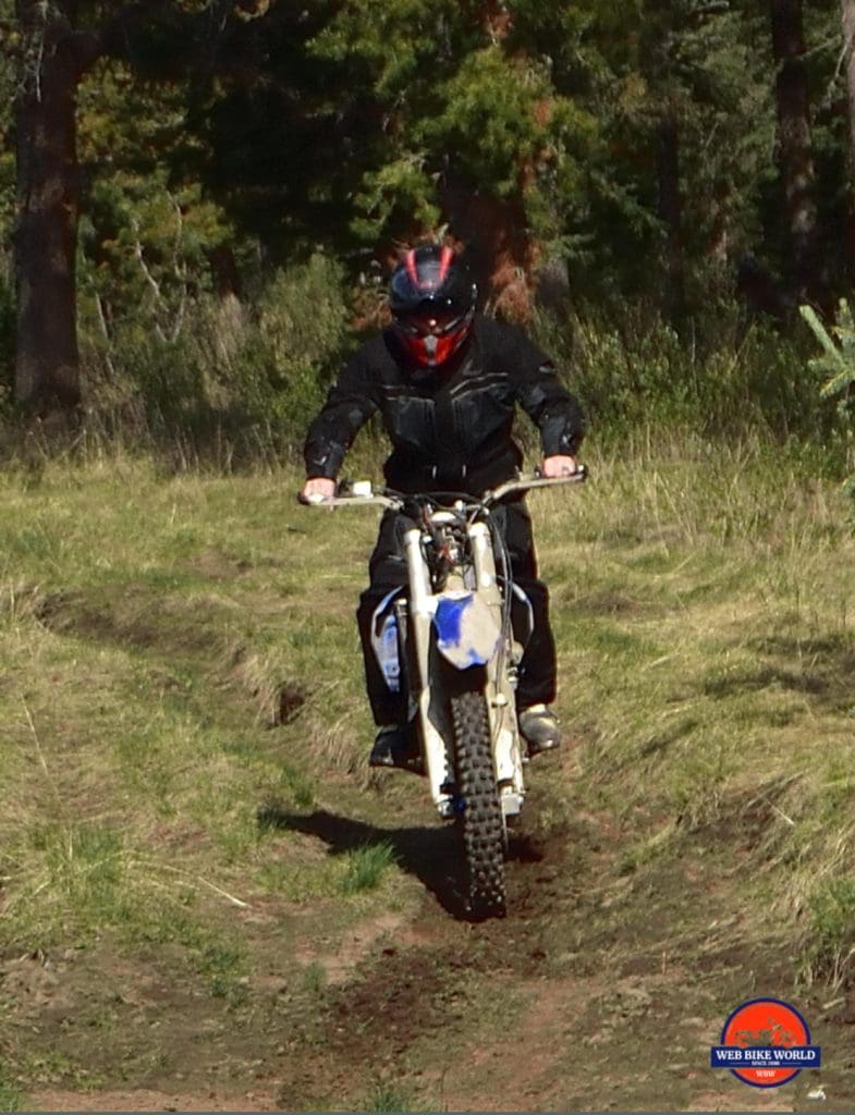 Action Shot of Rukka ROR ride on Dirt Path in Forest