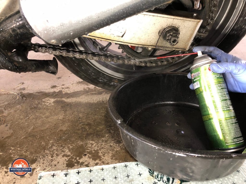Tirox Chain Cleaner Used on Bike Chain with Basin Underneath