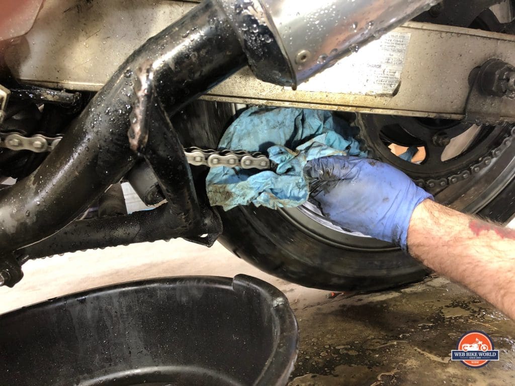 Cloth and Gloves Removing Excess Grime to Prep for Repeat