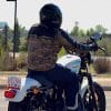 Rider in Camo on top Harley Davidson Motorcycle