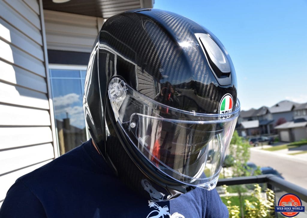 The AGV Sportmodular Carbon helmet on my head looking down.