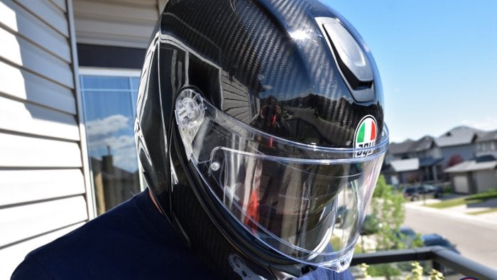 The AGV Sportmodular Carbon helmet on my head looking down.